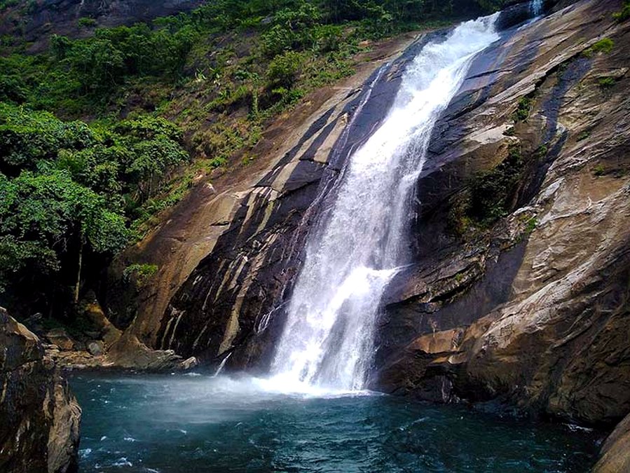 Waterfall cascading into a natural pool near Vagamon