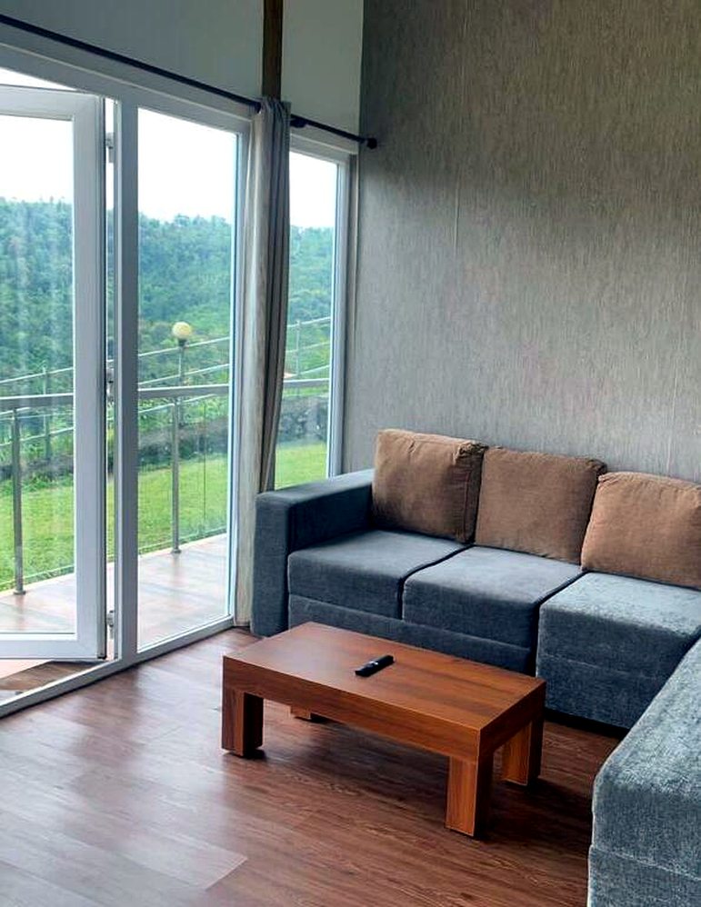Living room with sofa and hill views